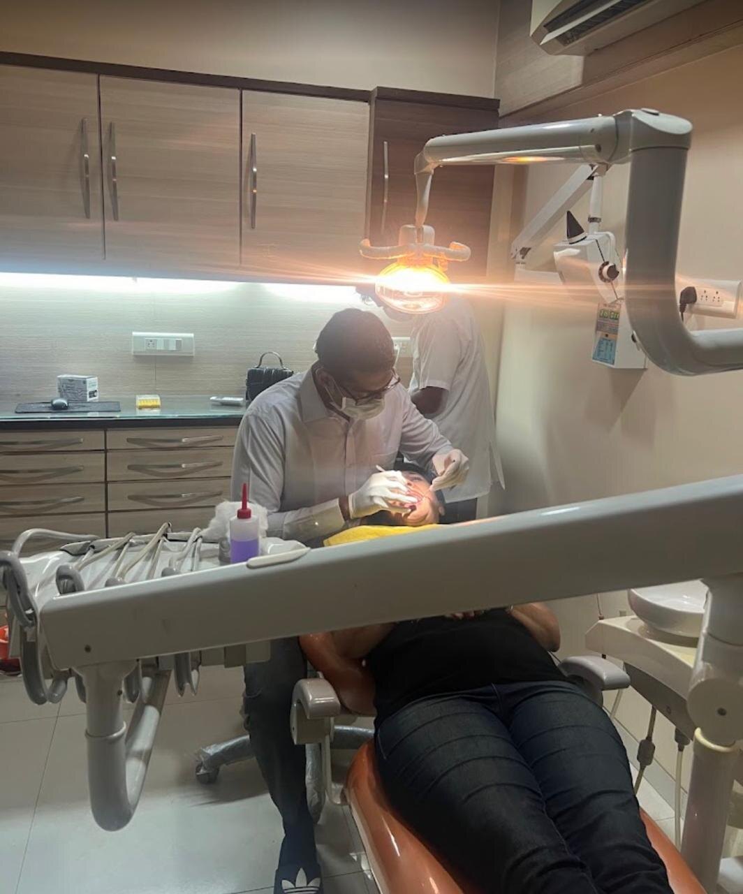 Dr. Anubhav Agarwal treating a patient in the surgery at Agarwal Dental Care
